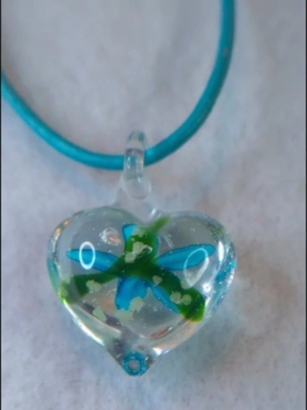Lampwork glass heart pendant / Blue and white flower encased inside clear glass